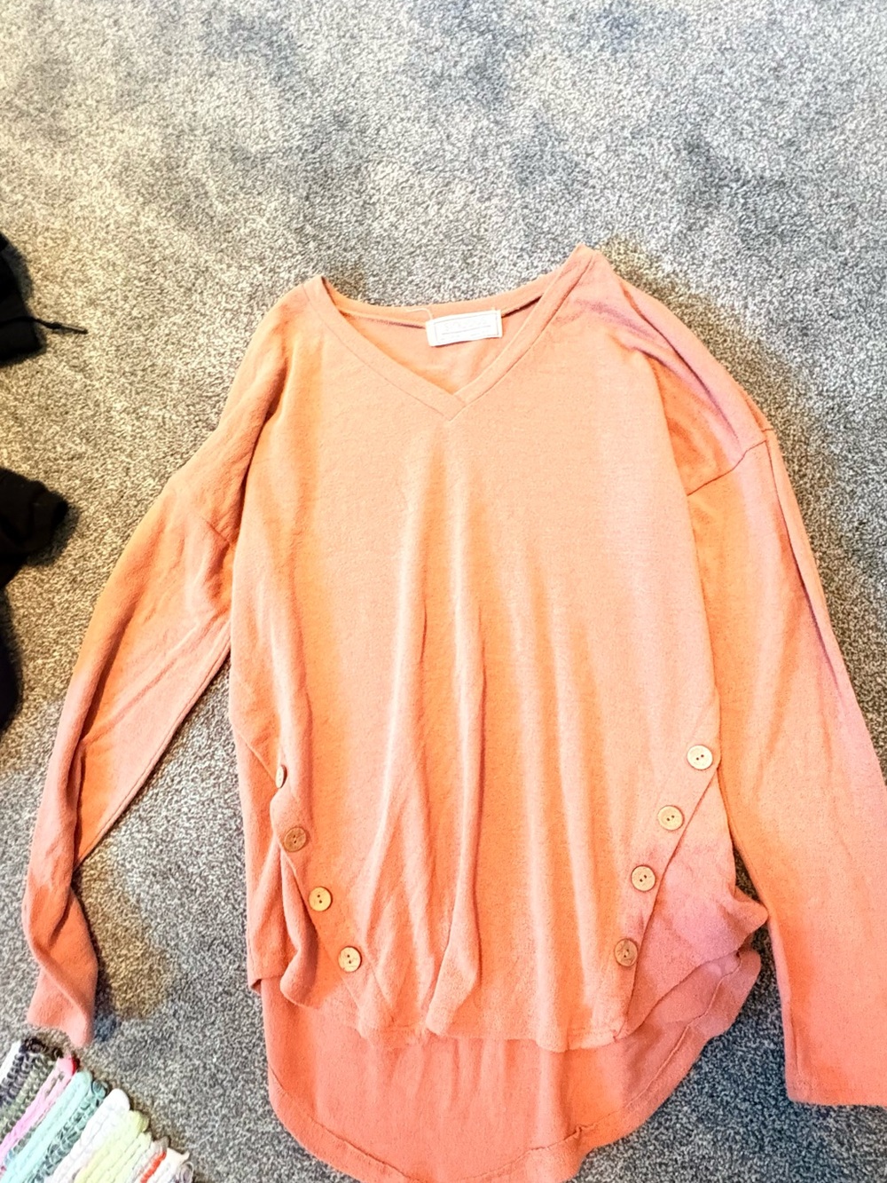 Relaxed Coral V-Neck Sweater with Side Button Accents